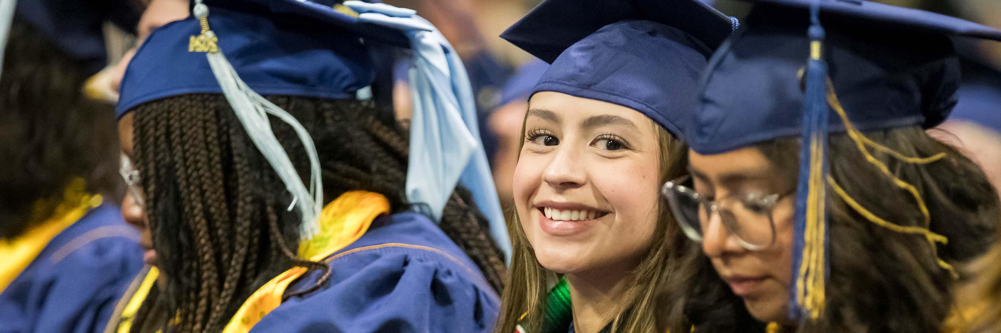 UNC Students gives a thumbs up while waiting for her name to be called.